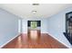 Bright living room featuring hardwood floors, light blue walls, and an open layout at 1553 Smithson Ct, Lithonia, GA 30058