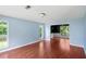 Inviting living room with hardwood floors, natural light and a view through to the dining room at 1553 Smithson Ct, Lithonia, GA 30058