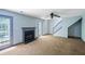 Spacious living room with a fireplace and a glass door leading to the outside at 1553 Smithson Ct, Lithonia, GA 30058