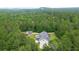 Aerial view of house and shed with a pool, surrounded by mature trees at 188 A Macedonia Rd, White, GA 30184