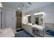 This bathroom features a long vanity, an enclosed shower, and tile flooring at 188 A Macedonia Rd, White, GA 30184