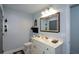 Clean bathroom with a vanity, toilet, and decorative shelves for storage and style at 188 A Macedonia Rd, White, GA 30184