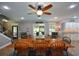 Bright dining room with wooden table, ceiling fan, and access to the outdoor space at 188 A Macedonia Rd, White, GA 30184