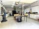 A spacious garage equipped with cabinets, work surfaces, and tools, suitable for a workshop or hobby area at 188 A Macedonia Rd, White, GA 30184