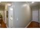 Hallway with hardwood floors, white trim, and access to multiple rooms at 188 A Macedonia Rd, White, GA 30184