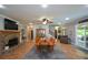 Spacious living room with fireplace, large table, and view to the outdoor space at 188 A Macedonia Rd, White, GA 30184