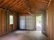 The interior of the shed features an open ceiling and garage door at 188 A Macedonia Rd, White, GA 30184