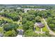An aerial view showcases the neighborhood's mature trees and landscape at 3155 Zion St, Scottdale, GA 30079