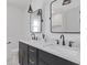 Bathroom featuring double sinks, stone countertops, and modern fixtures at 3155 Zion St, Scottdale, GA 30079
