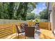 Outdoor deck space furnished with outdoor chairs and tables, surrounded by trees at 3155 Zion St, Scottdale, GA 30079