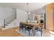 Bright dining area with hardwood floors adjacent to staircase and kitchen at 3155 Zion St, Scottdale, GA 30079