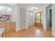 Welcoming foyer featuring hardwood floors, stylish decor, and a glimpse of the elegant front door at 3155 Zion St, Scottdale, GA 30079
