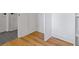 Hallway with hardwood and tile flooring leading to several rooms at 3155 Zion St, Scottdale, GA 30079