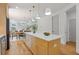 Bright kitchen features an island with a marble countertop and stainless steel appliances at 3155 Zion St, Scottdale, GA 30079