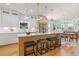 Modern kitchen with white cabinets, stainless steel appliances, and a large island at 3155 Zion St, Scottdale, GA 30079