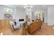 Open-concept living space with hardwood floors, fireplace, and plenty of natural light at 3155 Zion St, Scottdale, GA 30079