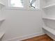 Pantry with wood floor and built-in white shelves at 3155 Zion St, Scottdale, GA 30079