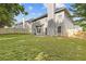 Expansive backyard with green grass, wood fence, and patio, creating a serene outdoor oasis at 4420 Ambassador Way, Cumming, GA 30040