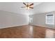 Bright and spacious bedroom features hardwood floors, a ceiling fan, and bright windows at 4420 Ambassador Way, Cumming, GA 30040