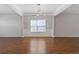 Elegant dining room featuring hardwood floors, contemporary lighting, and crown molding at 4420 Ambassador Way, Cumming, GA 30040