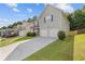 Street view of a well-kept home with a long driveway and green lawn at 4420 Ambassador Way, Cumming, GA 30040