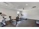 Well-equipped gym with stationary bike, rowing machine, elliptical, and treadmill to meet your exercise needs at 4420 Ambassador Way, Cumming, GA 30040