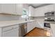 Well-equipped kitchen featuring stainless steel appliances and white cabinetry at 4420 Ambassador Way, Cumming, GA 30040
