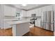Kitchen with stainless appliances, white cabinets, and quartz countertops at 4420 Ambassador Way, Cumming, GA 30040