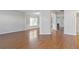 Spacious living area with hardwood floors, open layout, and neutral paint at 4420 Ambassador Way, Cumming, GA 30040