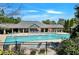 An amazing pool and recreation center featuring red mushroom fountains and ample seating around the pool at 4420 Ambassador Way, Cumming, GA 30040