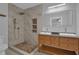 Modern bathroom featuring a walk-in shower, double vanity, and stylish tile work for a spa-like experience at 1667 Sylvan Sw Rd, Atlanta, GA 30310