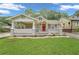 Charming bungalow with a front porch and well-manicured lawn at 1667 Sylvan Sw Rd, Atlanta, GA 30310