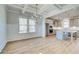 Elegant dining room with coffered ceilings and an open view to the modern kitchen at 213 Ruthe Cv, Locust Grove, GA 30248