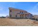 New home rear elevation with covered patio overlooking a spacious backyard at 213 Ruthe Cv, Locust Grove, GA 30248