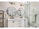 Stylish bathroom with a double sink vanity, modern fixtures, and a glass-enclosed shower at 3003 Hanover Se Ln, Conyers, GA 30094