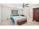 Bedroom features a ceiling fan and an adjoining bathroom at 3003 Hanover Se Ln, Conyers, GA 30094