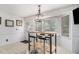 Eat-in kitchen with modern light fixture, tile floor, and natural light at 3003 Hanover Se Ln, Conyers, GA 30094
