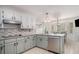 Beautiful kitchen featuring white cabinets, stainless steel appliances, and a breakfast area with natural light at 3003 Hanover Se Ln, Conyers, GA 30094