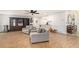Bright living room with hardwood floors, comfortable seating, and built-in shelving for ample storage at 3003 Hanover Se Ln, Conyers, GA 30094