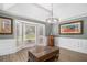 Bright living room with decorative molding, a pendant light and large windows at 3003 Hanover Se Ln, Conyers, GA 30094