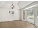 Bright living room with decorative molding, a pendant light and a wall art at 3003 Hanover Se Ln, Conyers, GA 30094