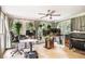 Spacious home office with multiple windows, ceiling fan, and tile floor at 3003 Hanover Se Ln, Conyers, GA 30094