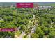 Aerial view showcasing the home's location, surrounded by lush greenery, and proximity to Historic Roswell at 365 Norcross St, Roswell, GA 30075