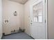 A basement room with exposed pipes and a door with a glass pane for natural light at 365 Norcross St, Roswell, GA 30075