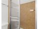 Shower featuring tan tiles, sliding glass door and stainless steel hardware at 365 Norcross St, Roswell, GA 30075