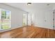 Bright bedroom with hardwood floors, two windows, and a closet at 365 Norcross St, Roswell, GA 30075