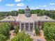 Exterior of City Hall with columns and stairs and an American flag on display at 365 Norcross St, Roswell, GA 30075