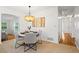 Cozy dining area with modern lighting fixture and seating for four at 365 Norcross St, Roswell, GA 30075