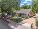 Quaint exterior view of a charming business featuring a patio, American flag, and beautiful landscaping at 365 Norcross St, Roswell, GA 30075