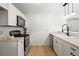 Well-equipped kitchen with modern appliances and ample countertop space at 365 Norcross St, Roswell, GA 30075